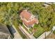 Aerial view of a charming home with a well-manicured lawn and mature trees at 122 N Hyer Ave, Orlando, FL 32801