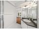 Bathroom featuring a dark granite vanity top with a view to the backyard at 122 N Hyer Ave, Orlando, FL 32801