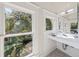 Bathroom featuring large windows and modern sink and tile at 122 N Hyer Ave, Orlando, FL 32801