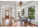 Dining area with hardwood floors, natural light, and view to front of home at 122 N Hyer Ave, Orlando, FL 32801