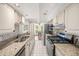 Spacious kitchen featuring stainless steel appliances, granite countertops, and white cabinetry at 122 N Hyer Ave, Orlando, FL 32801