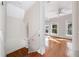 Staircase leading to a bedroom with hardwood floors and sun filled windows at 122 N Hyer Ave, Orlando, FL 32801