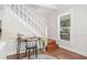 Interior staircase with hardwood floors and window for natural light at 122 N Hyer Ave, Orlando, FL 32801