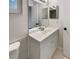 Updated bathroom featuring a white vanity with modern fixtures and a bright, clean aesthetic at 13842 Belvin Ct, Orlando, FL 32826