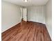 This bedroom features laminate wood flooring and a built-in closet at 13842 Belvin Ct, Orlando, FL 32826