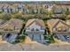 Aerial view of townhomes with a landscaped neighborhood, parking, and community pool at 1710 San Jacinto Cir # 1710, Sanford, FL 32771