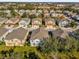 An aerial view of a neighborhood featuring colorful two-story homes and well-maintained lawns at 1710 San Jacinto Cir # 1710, Sanford, FL 32771