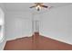 Bedroom featuring wood floors, closet, ceiling fan and neutral paint at 1710 San Jacinto Cir # 1710, Sanford, FL 32771