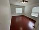 This bedroom features sleek hard wood floors and natural lighting at 1710 San Jacinto Cir # 1710, Sanford, FL 32771