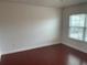 An empty bedroom with a window and faux-wood flooring at 1710 San Jacinto Cir # 1710, Sanford, FL 32771