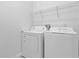 Laundry room with a white washer and dryer, wire shelving, and white walls at 1710 San Jacinto Cir # 1710, Sanford, FL 32771