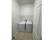 A compact laundry room with a side-by-side washer and dryer in a closet at 1710 San Jacinto Cir # 1710, Sanford, FL 32771