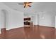 Spacious living room with hardwood floors, neutral walls, and arched doorway leading to the kitchen at 1710 San Jacinto Cir # 1710, Sanford, FL 32771