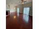 Living room with hardwood floors and sliding glass doors to balcony at 1710 San Jacinto Cir # 1710, Sanford, FL 32771