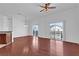 Living room with hardwood floors, neutral walls, and two sets of sliding glass doors to the balcony at 1710 San Jacinto Cir # 1710, Sanford, FL 32771