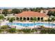 Community pool with ample seating at 1770 Coriander Dr, Kissimmee, FL 34759