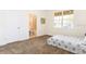 Bright bedroom with plush carpet, large window, and convenient access to an ensuite bathroom at 1772 Coriander Dr, Kissimmee, FL 34759