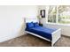 Cozy bedroom with a comfortable bed, ample natural light, and neutral color palette at 1772 Coriander Dr, Kissimmee, FL 34759