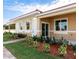 Inviting single-story home featuring a tile roof, manicured lawn, and a welcoming entryway at 1772 Coriander Dr, Kissimmee, FL 34759