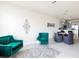 Bright living space featuring modern furniture, stylish decor, and seamless flow to dining area at 1772 Coriander Dr, Kissimmee, FL 34759
