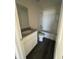 Bathroom featuring a white vanity, granite countertop, and tub with white tile surround at 1926 Golden Beak Dr, Eagle Lake, FL 33839