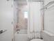 Clean bathroom showcasing a shower-tub combo with marble tiling and a modern shower head at 1932 Temple Dr, Winter Park, FL 32789