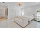 Bright bedroom featuring white marble floors, a modern light fixture, and ample natural light at 1932 Temple Dr, Winter Park, FL 32789