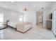 Bright bedroom featuring white marble floors, a modern light fixture, and ample natural light at 1932 Temple Dr, Winter Park, FL 32789