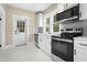 Bright kitchen with stainless steel appliances and white cabinets at 202 Division, Deland, FL 32720