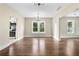 Open dining room featuring hardwood floors, chandelier, and natural light at 202 Division, Deland, FL 32720