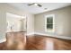 Bright living room boasts hardwood floors and natural light from a large window at 202 Division, Deland, FL 32720