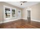 Bright living room with hardwood floors, a ceiling fan, and natural light at 202 Division, Deland, FL 32720