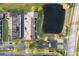 Aerial view of townhomes situated next to a pond with convenient parking at 2207 Island Walk Dr, Orlando, FL 32824