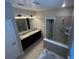 Bathroom features a double vanity, soaking tub, and tiled shower at 2523 Econ Landing Blvd, Orlando, FL 32825