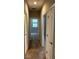 Hallway with carpet flooring and access to multiple rooms at 2523 Econ Landing Blvd, Orlando, FL 32825