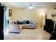 Comfortable living room features plush sofa, ceiling fan, and neutral color scheme at 282 Scottsdale Sq # 282, Winter Park, FL 32792