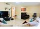 Spacious living room featuring tile floors, neutral color scheme and ceiling fan at 282 Scottsdale Sq # 282, Winter Park, FL 32792