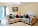 Comfortable living room featuring a sectional sofa, neutral colors and a ceiling fan at 282 Scottsdale Sq # 282, Winter Park, FL 32792