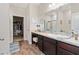 Bathroom featuring a large vanity, ample counter space, and a walk-in closet at 2857 Neverland Dr, New Smyrna Beach, FL 32168