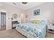 Bright bedroom featuring natural light, comfortable bed, and coastal decor at 2857 Neverland Dr, New Smyrna Beach, FL 32168