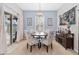 Bright dining room featuring stylish chandelier, decor, and access to outdoor space at 2857 Neverland Dr, New Smyrna Beach, FL 32168