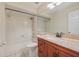 Clean bathroom showcasing a combined bathtub and shower, a vanity with granite countertops, and a large mirror at 302 Bridie Ct, Winter Springs, FL 32708