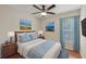 Bedroom with a ceiling fan, large window and matching nightstands at 302 Bridie Ct, Winter Springs, FL 32708