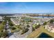 Aerial view showcases a well-maintained community with landscaping, water features, and neatly arranged townhome residences at 360 Arbor Lakes Dr, Davenport, FL 33896