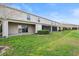 Exterior of home with a well-maintained lawn, and several patios at 360 Arbor Lakes Dr, Davenport, FL 33896