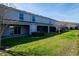 Backyard view featuring well-maintained lawn, and several patios at 360 Arbor Lakes Dr, Davenport, FL 33896