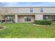 Exterior of home with a well-maintained lawn, and several patios at 360 Arbor Lakes Dr, Davenport, FL 33896