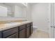 Modern bathroom featuring double sinks, a large mirror, and a walk-in shower at 360 Arbor Lakes Dr, Davenport, FL 33896