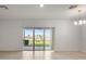 Dining room with a sliding glass door and view to the lake at 360 Arbor Lakes Dr, Davenport, FL 33896