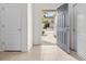 Bright entryway with tile flooring, coat closet, and an open doorway leading outside at 360 Arbor Lakes Dr, Davenport, FL 33896